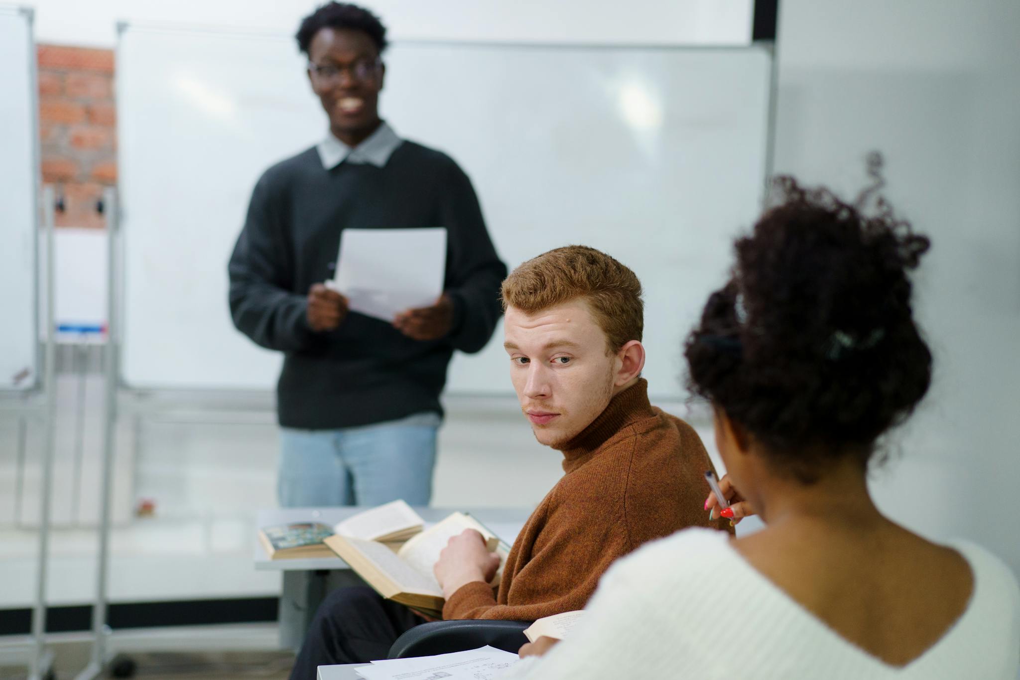 Woman in Brown Sweater Standing Beside Man in White Sweater